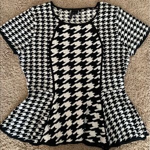 Short sleeve swears with a peplum hem.